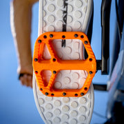 https://cdn.shopify.com/s/files/1/0284/9430/files/OneUpComponents_CompositePedals_ORA_Lifestyle1.jpg?v=1747436600