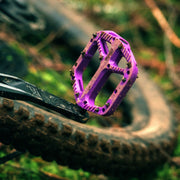 https://cdn.shopify.com/s/files/1/0284/9430/files/OneUpComponents_CompositePedals_PUR_Lifestyle1.jpg?v=1747436600